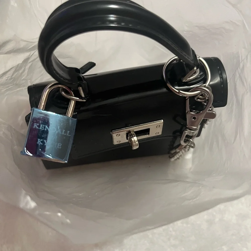 Kendall and Kylie mini tote bag or purse charm. Has a crossbody strap with it.